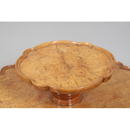 491 - AN EARLY 20TH CENTURY BURR WOOD LAZY SUSAN. with two revolving tiers to shaped oak borders and turne... 