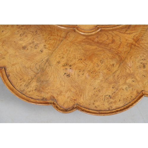 491 - AN EARLY 20TH CENTURY BURR WOOD LAZY SUSAN. with two revolving tiers to shaped oak borders and turne... 