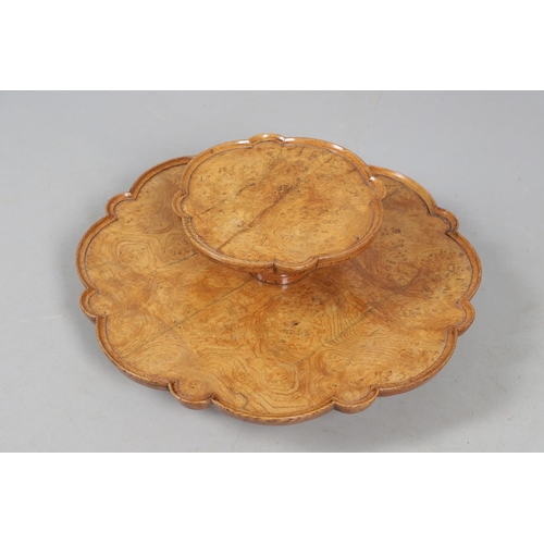 491 - AN EARLY 20TH CENTURY BURR WOOD LAZY SUSAN. with two revolving tiers to shaped oak borders and turne... 