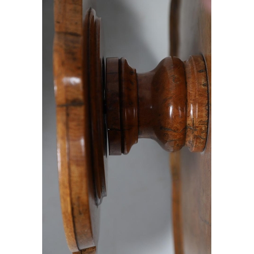 491 - AN EARLY 20TH CENTURY BURR WOOD LAZY SUSAN. with two revolving tiers to shaped oak borders and turne... 