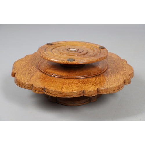 491 - AN EARLY 20TH CENTURY BURR WOOD LAZY SUSAN. with two revolving tiers to shaped oak borders and turne... 