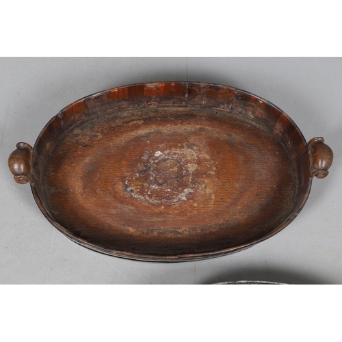 492 - A GEORGE III WALNUT BRASS COOPERED TRAY/PLANTER. with scroll handles, later tin liner and flower gri... 