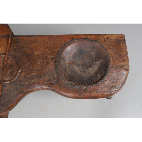 498 - A 19TH CENTURY ELM (?) COBBLER'S BENCH. with divisional section to one end and copper studded leathe... 