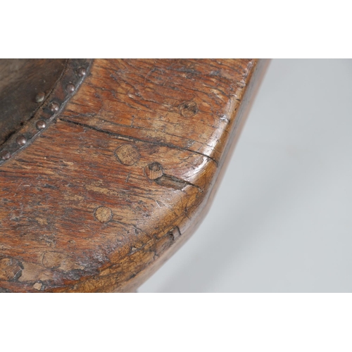 498 - A 19TH CENTURY ELM (?) COBBLER'S BENCH. with divisional section to one end and copper studded leathe... 