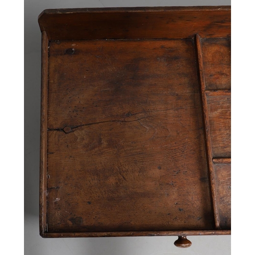 498 - A 19TH CENTURY ELM (?) COBBLER'S BENCH. with divisional section to one end and copper studded leathe... 