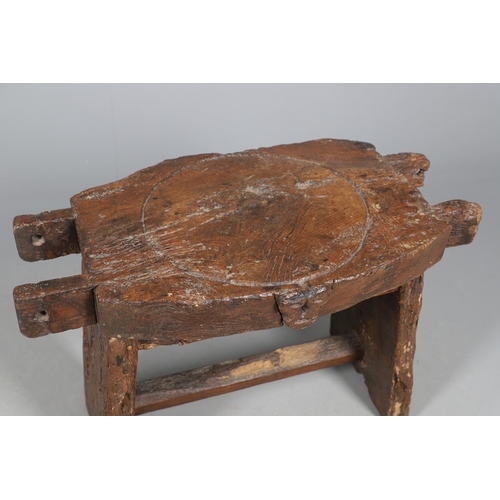 499 - A PRIMITIVE OAK CHEESE PRESS, CONVERTED TO A TABLE. 18th century, the top with original whey drain, ... 