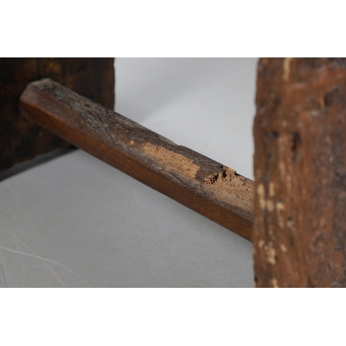 499 - A PRIMITIVE OAK CHEESE PRESS, CONVERTED TO A TABLE. 18th century, the top with original whey drain, ... 