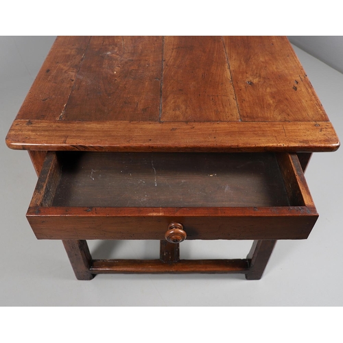 500 - A 19TH CENTURY FRUITWOOD FARMHOUSE TABLE. the multiple plank upon block supports united by a stretch... 