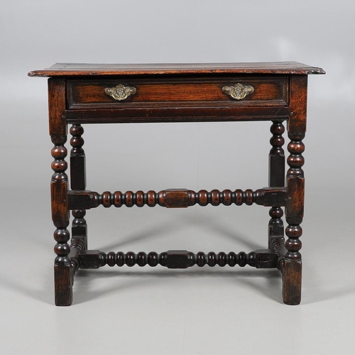 501 - A CHARLES II OAK SIDE TABLE. the moulded edge top over single drawer with applied moulding, on turne... 