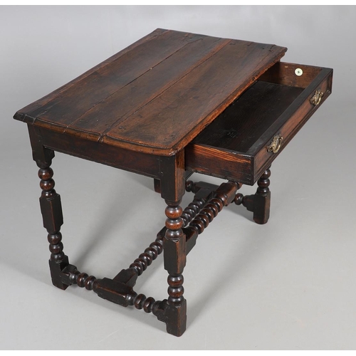 501 - A CHARLES II OAK SIDE TABLE. the moulded edge top over single drawer with applied moulding, on turne... 