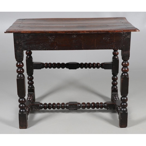 501 - A CHARLES II OAK SIDE TABLE. the moulded edge top over single drawer with applied moulding, on turne... 