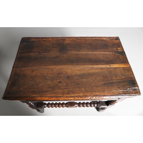 501 - A CHARLES II OAK SIDE TABLE. the moulded edge top over single drawer with applied moulding, on turne... 