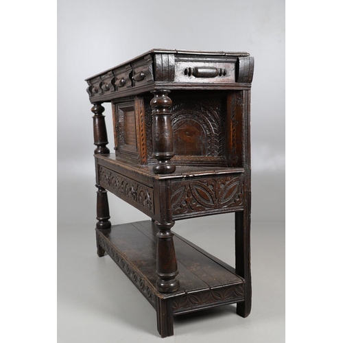 502 - A 17TH CENTURY OAK AND MARQUETRY COURT CUPBOARD. the upper trapezoidal section centred by cupboard d... 