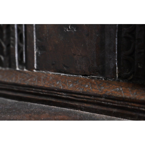 502 - A 17TH CENTURY OAK AND MARQUETRY COURT CUPBOARD. the upper trapezoidal section centred by cupboard d... 