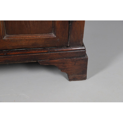 503 - AN EARLY 19TH CENTURY WELSH OAK CUPBOARD. with three small drawers above ogee arch panelled cupboard... 