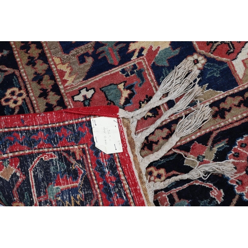 507 - A HERIZ DESIGN CARPET. the faded strawberry field centred by an indigo medallion framed by spandrels... 