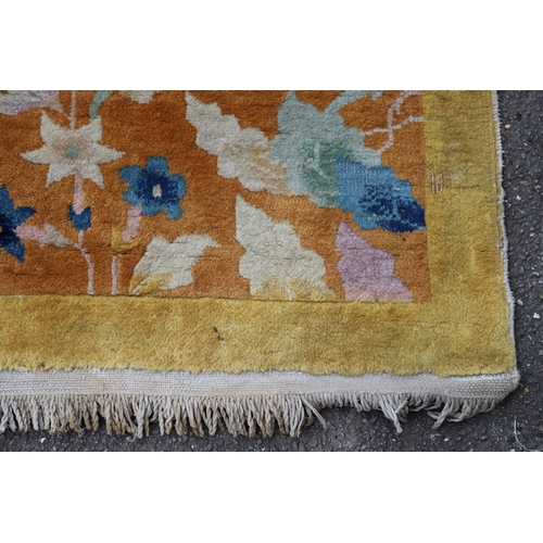 510 - A WALTER NICHOLS 'ART DECO' CHINESE CARPET, CIRCA 1925. the mustard field sparsely decorated with na... 