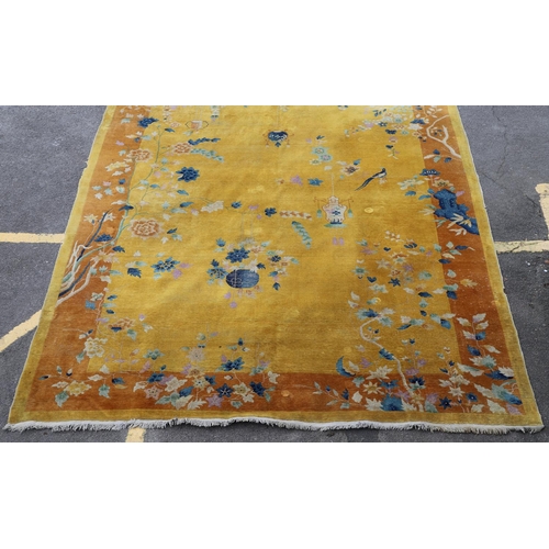 510 - A WALTER NICHOLS 'ART DECO' CHINESE CARPET, CIRCA 1925. the mustard field sparsely decorated with na... 