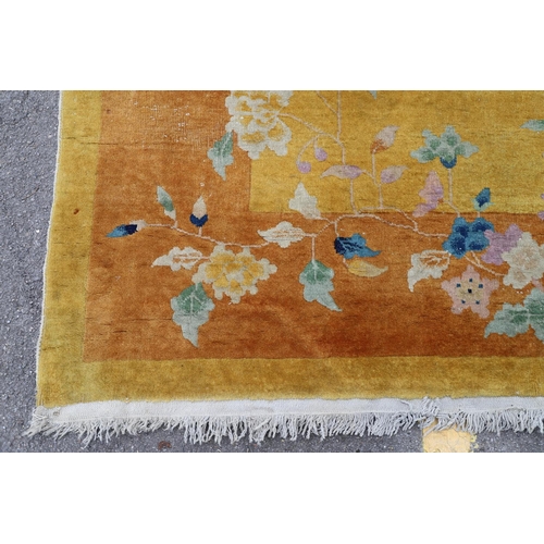 510 - A WALTER NICHOLS 'ART DECO' CHINESE CARPET, CIRCA 1925. the mustard field sparsely decorated with na... 