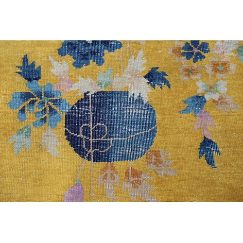 510 - A WALTER NICHOLS 'ART DECO' CHINESE CARPET, CIRCA 1925. the mustard field sparsely decorated with na... 