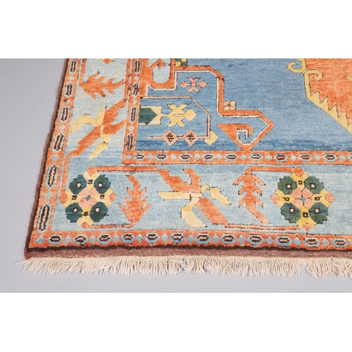 512 - A WEST ANATOLIAN CARPET, 1980S. the abrashed indigo field with central terracotta medallion framed b... 