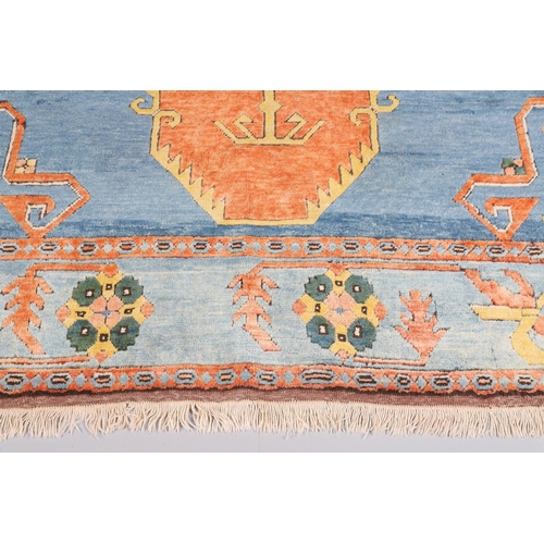 512 - A WEST ANATOLIAN CARPET, 1980S. the abrashed indigo field with central terracotta medallion framed b... 