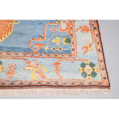 512 - A WEST ANATOLIAN CARPET, 1980S. the abrashed indigo field with central terracotta medallion framed b... 