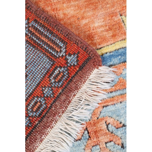 512 - A WEST ANATOLIAN CARPET, 1980S. the abrashed indigo field with central terracotta medallion framed b... 