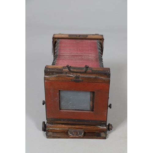 541 - LARGE PLATE CAMERA - PHOTO HALL, PARIS. A large mahogany plate camera with red coloured bellows, wit... 