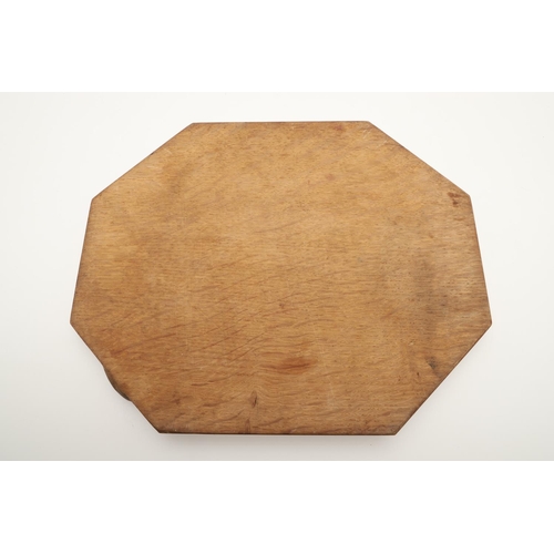 550 - ROBERT THOMPSON OF KILBURN - MOUSEMAN BREAD BOARD & CHEESE BOARD. Including an octagonal shaped oak ... 