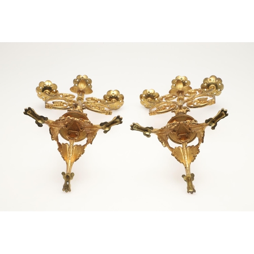 551 - PAIR OF ARTS & CRAFTS GILT BRASS CANDLESTICKS. In the manner of Eugene Emmanuel Viollet Le Duc, the ... 