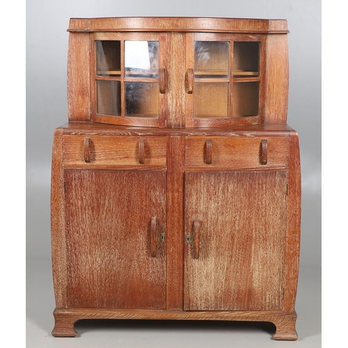 553 - ART DECO LIMED OAK SIDEBOARD - POSSIBLY BY HEALS. A limed oak sideboard possibly by Heals, the bow f... 