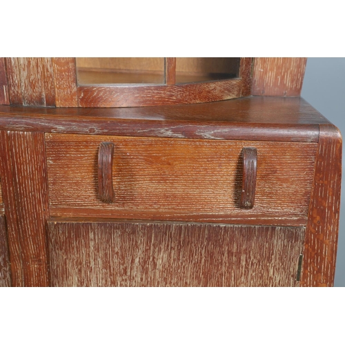 553 - ART DECO LIMED OAK SIDEBOARD - POSSIBLY BY HEALS. A limed oak sideboard possibly by Heals, the bow f... 