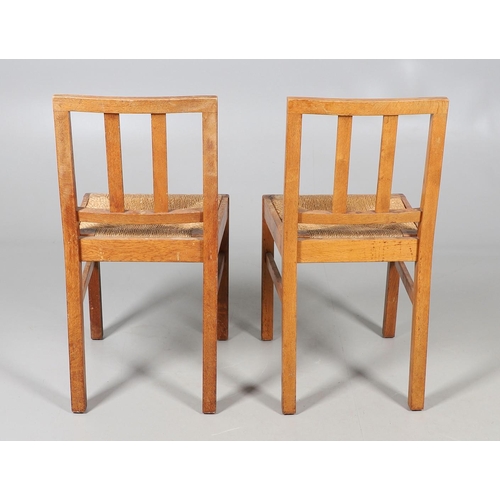 554 - BRYNMAWR FURNITURE - PAIR OF DINING CHAIRS. A pair of oak dining chairs with vertical splats and dro... 