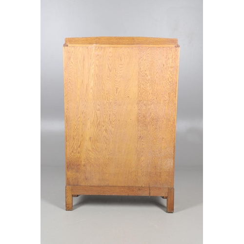 556 - BRYNMAWR FURNITURE - OAK DISPLAY CABINET. An oak display cabinet with a glazed top section with a si... 