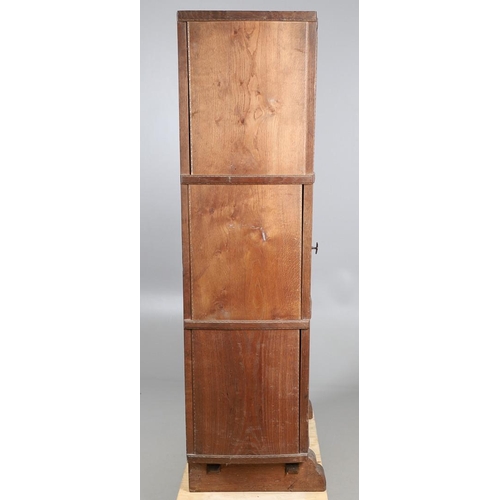 559 - A COTSWOLD SCHOOL ARTS AND CRAFTS OAK WARDROBE BY ERNEST GIMSON. A large and impressive oak Cotswold... 