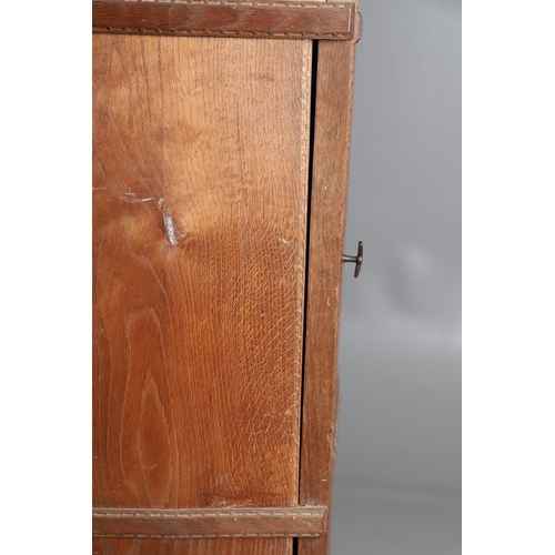 559 - A COTSWOLD SCHOOL ARTS AND CRAFTS OAK WARDROBE BY ERNEST GIMSON. A large and impressive oak Cotswold... 