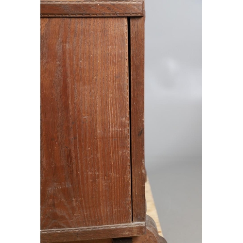 559 - A COTSWOLD SCHOOL ARTS AND CRAFTS OAK WARDROBE BY ERNEST GIMSON. A large and impressive oak Cotswold... 