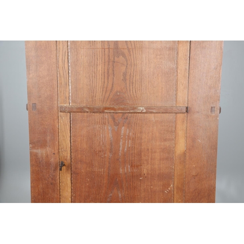 559 - A COTSWOLD SCHOOL ARTS AND CRAFTS OAK WARDROBE BY ERNEST GIMSON. A large and impressive oak Cotswold... 