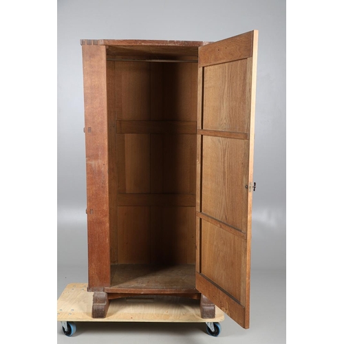 559 - A COTSWOLD SCHOOL ARTS AND CRAFTS OAK WARDROBE BY ERNEST GIMSON. A large and impressive oak Cotswold... 