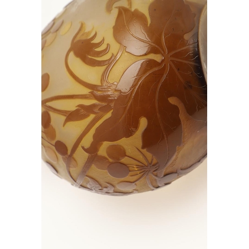 577 - GALLE CAMEO GLASS VASE. A Galle cameo glass vase, etched with flowers and berries in brown and yello... 