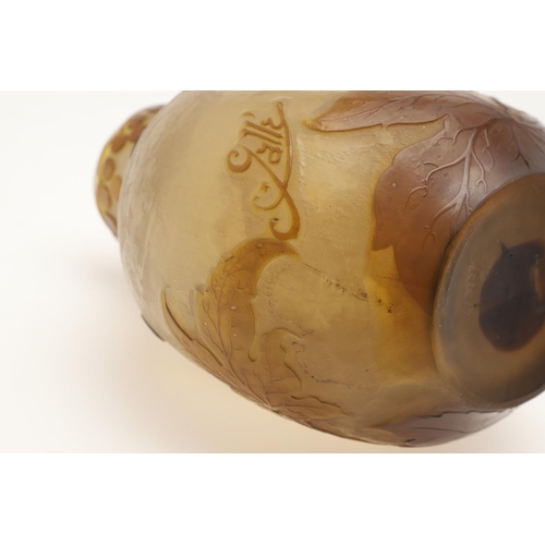 577 - GALLE CAMEO GLASS VASE. A Galle cameo glass vase, etched with flowers and berries in brown and yello... 