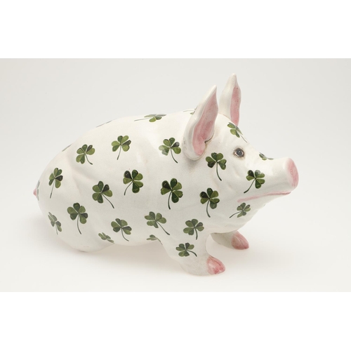 580 - A LARGE WEMYSS SHAMROCK PIG. A Wemyss pig of large size, painted with shamrocks to the body. Painted... 