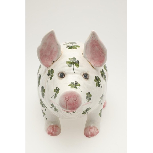 580 - A LARGE WEMYSS SHAMROCK PIG. A Wemyss pig of large size, painted with shamrocks to the body. Painted... 