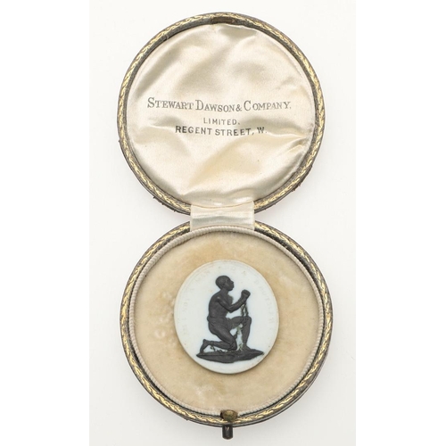 582 - A WEDGWOOD ANTI-SLAVERY MEDALLION, C. 1787. depicting a figure kneeling in supplication, his ankles ... 