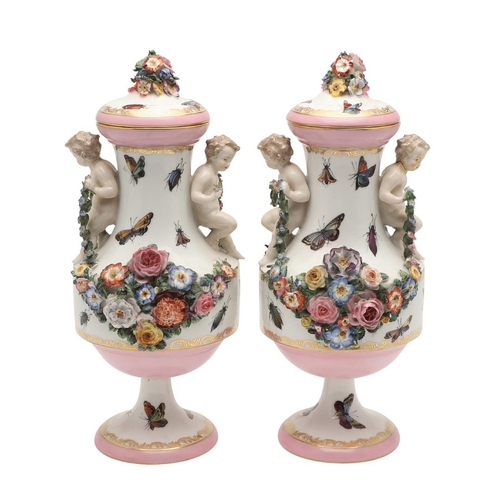 588 - PAIR OF MEISSEN STYLE LIDDED VASES. A pair of large lidded vases or jars, the lids with floral encru... 