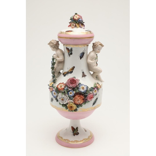 588 - PAIR OF MEISSEN STYLE LIDDED VASES. A pair of large lidded vases or jars, the lids with floral encru... 