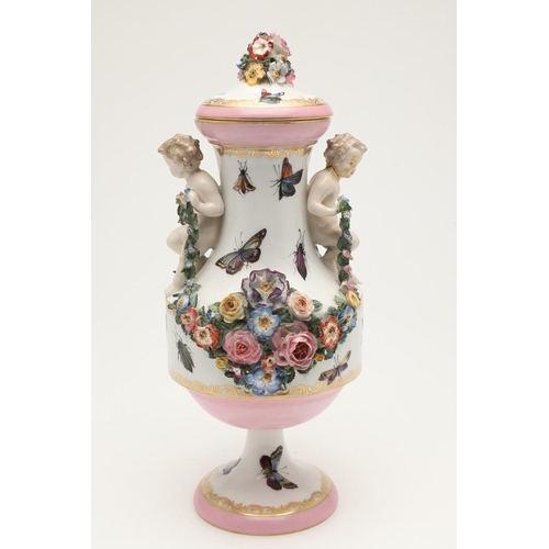 588 - PAIR OF MEISSEN STYLE LIDDED VASES. A pair of large lidded vases or jars, the lids with floral encru... 