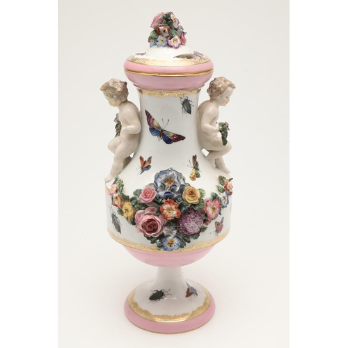 588 - PAIR OF MEISSEN STYLE LIDDED VASES. A pair of large lidded vases or jars, the lids with floral encru... 