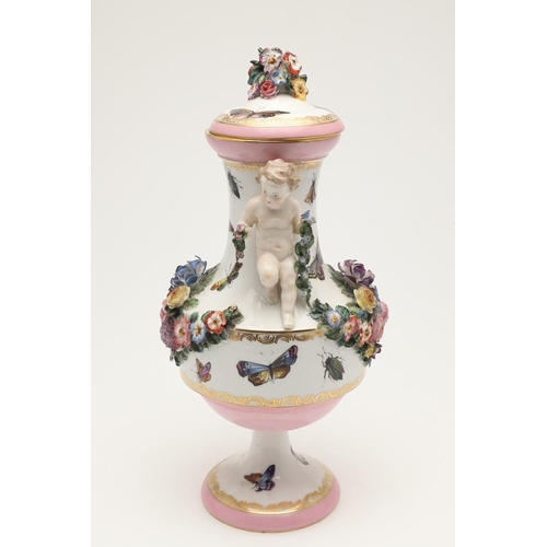 588 - PAIR OF MEISSEN STYLE LIDDED VASES. A pair of large lidded vases or jars, the lids with floral encru... 